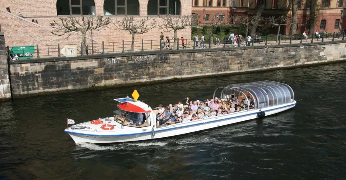 An electric boat passing Museum Island and the museums in Berlin, Germany